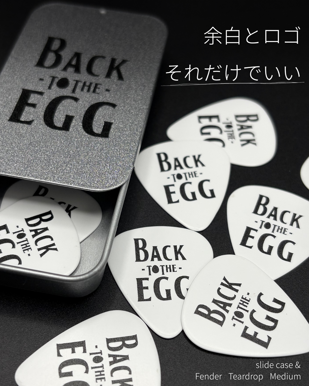 BACK TO THE EGGロゴのオリジナルギターピック Fender Teardrop Mediumとスライドケース缶